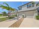 Two-story townhouses with attached garages and landscaping at 928 Royal Empress Dr, Ruskin, FL 33570