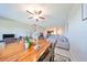 Dining area with wooden table, chairs, and view into the living room and kitchen at 928 Royal Empress Dr, Ruskin, FL 33570