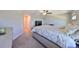Main bedroom with a king-size bed and access to the bathroom at 928 Royal Empress Dr, Ruskin, FL 33570