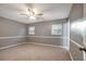 Spacious bedroom with neutral walls, ceiling fan, and carpet flooring at 2371 Dustin Cir, Spring Hill, FL 34608