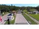 Community entrance with paved road and landscaping at 4716 Hickory Oak Dr, Brooksville, FL 34601