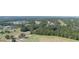 Aerial view of a golf course with houses and trees at 4716 Hickory Oak Dr, Brooksville, FL 34601