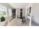 Home office with built-in shelving and a large desk at 4716 Hickory Oak Dr, Brooksville, FL 34601