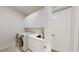 Clean laundry room with modern washer, dryer, and cabinets at 4716 Hickory Oak Dr, Brooksville, FL 34601