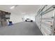 Spacious two-car garage with epoxy flooring and storage at 4716 Hickory Oak Dr, Brooksville, FL 34601