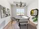 Bright dining room with a marble table and modern chairs at 4716 Hickory Oak Dr, Brooksville, FL 34601