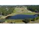Aerial view of golf course with a pond at 4716 Hickory Oak Dr, Brooksville, FL 34601