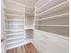 Large walk-in closet with ample shelving and drawers at 4716 Hickory Oak Dr, Brooksville, FL 34601