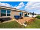 Landscaped backyard with a patio and plenty of green space at 15502 Black Pepper Ln, Odessa, FL 33556