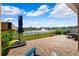 Private backyard oasis with a patio and pond view at 15502 Black Pepper Ln, Odessa, FL 33556
