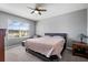 Comfortable bedroom with a king-size bed and ample natural light at 15502 Black Pepper Ln, Odessa, FL 33556