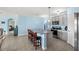 Modern kitchen with stainless steel appliances and island, view from living room at 15502 Black Pepper Ln, Odessa, FL 33556