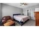Spacious bedroom with a king-size bed and ensuite bathroom access at 15502 Black Pepper Ln, Odessa, FL 33556