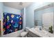 Bright bathroom with a bathtub, shower, and updated vanity at 15502 Black Pepper Ln, Odessa, FL 33556