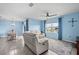 Spacious living room with large windows and comfortable seating at 15502 Black Pepper Ln, Odessa, FL 33556