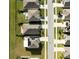 Aerial view of houses with solar panels at 15502 Black Pepper Ln, Odessa, FL 33556