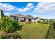 Expansive backyard with lush lawn and privacy fence at 15502 Black Pepper Ln, Odessa, FL 33556