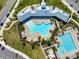 Two pools, including a lap pool and leisure pool with surrounding lounge chairs at 15502 Black Pepper Ln, Odessa, FL 33556