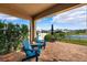 Relaxing patio with two chairs, perfect for outdoor seating at 15502 Black Pepper Ln, Odessa, FL 33556