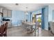 Bright dining area features a large table, chairs, and access to the kitchen at 15502 Black Pepper Ln, Odessa, FL 33556
