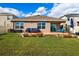 Large backyard with patio, offering ample outdoor space at 15502 Black Pepper Ln, Odessa, FL 33556