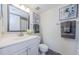 Bathroom with a white vanity, grey stone floor, and decorative accents at 2690 Coral Landings Blvd # 722, Palm Harbor, FL 34684