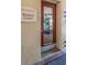 The Meadowlake Business Center features a clean glass entry door and signage at 2690 Coral Landings Blvd # 722, Palm Harbor, FL 34684