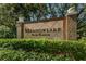 Elegant Meadowlake Palm Harbor sign surrounded by lush greenery at 2690 Coral Landings Blvd # 722, Palm Harbor, FL 34684