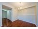 Dining room featuring wood flooring and decorative lighting, with access to storage at 2690 Coral Landings Blvd # 722, Palm Harbor, FL 34684