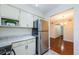 Kitchen with stainless steel appliances, light countertops, and access to dining area at 2690 Coral Landings Blvd # 722, Palm Harbor, FL 34684