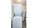Laundry area with a stacked washer and dryer unit at 2690 Coral Landings Blvd # 722, Palm Harbor, FL 34684
