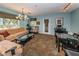 Inviting living area with modern decor, plush seating, and large windows offering natural light at 2690 Coral Landings Blvd # 722, Palm Harbor, FL 34684