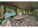 Inviting patio area near pool, offering a perfect spot for enjoying the outdoors and poolside relaxation at 2690 Coral Landings Blvd # 722, Palm Harbor, FL 34684