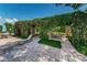 Beautiful outdoor patio with lush vines growing over pergola, perfect for relaxation and entertainment at 2690 Coral Landings Blvd # 722, Palm Harbor, FL 34684