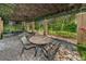 Comfortable patio with table and chairs offering a shady space, great for outdoor dining or lounging at 2690 Coral Landings Blvd # 722, Palm Harbor, FL 34684