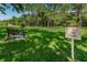 Enjoy the outdoors at the community's pet park, complete with a shaded bench and lush green space at 2690 Coral Landings Blvd # 722, Palm Harbor, FL 34684