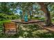 Community playground under shady trees with benches, offering children a fun play area at 2690 Coral Landings Blvd # 722, Palm Harbor, FL 34684