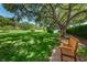 Relax on a shady bench overlooking the community's picturesque pond and verdant green spaces at 2690 Coral Landings Blvd # 722, Palm Harbor, FL 34684