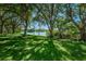 Enjoy scenic views of the community pond from the lush green lawn and shady trees at 2690 Coral Landings Blvd # 722, Palm Harbor, FL 34684