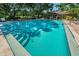 Large community pool with clean, clear water and inviting steps, perfect for swimming and recreation at 2690 Coral Landings Blvd # 722, Palm Harbor, FL 34684