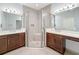 Bathroom showcasing a glass enclosed shower and double vanity with white countertop at 4847 Marble Springs Cir, Wimauma, FL 33598