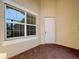 Front entryway with a white door and tiled flooring at 4847 Marble Springs Cir, Wimauma, FL 33598