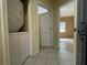 A hallway with access to multiple rooms and tiled flooring at 6007 Skydale Way # 201, Riverview, FL 33578