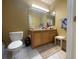 Bathroom features a double sink vanity, toilet and a large mirror at 6007 Skydale Way # 201, Riverview, FL 33578