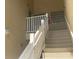 Interior stairwell with white railings leading to upper levels at 6007 Skydale Way # 201, Riverview, FL 33578