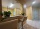 Kitchen features a breakfast bar with seating and access to the living area at 6007 Skydale Way # 201, Riverview, FL 33578