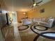 Living room boasts a neutral color palette, plush sofa, and circular area rug at 6007 Skydale Way # 201, Riverview, FL 33578