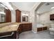 Bathroom with granite countertops, large soaking tub, and walk-in shower at 700 Island Way # 106, Clearwater Beach, FL 33767