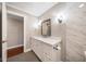 Bathroom featuring white cabinets, marble countertops, modern fixtures, and designer tile at 700 Island Way # 106, Clearwater Beach, FL 33767
