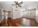 Hardwood floor living room with access to hallway and another room at 700 Island Way # 106, Clearwater Beach, FL 33767